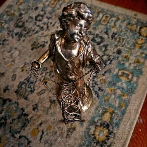 Silverplated boy statue